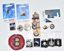A collection of collectable badges including RAF, Bluebird Club, Postmen's Federation, Butlins