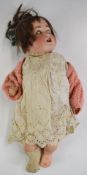 Schutzmeister & Quendt bisque headed doll with weighted blue eyes, open mouth, brown hair and