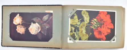 Album of approximately 100 vintage flower postcards (c1930s/40s) including two by Margaret