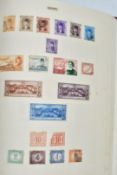 A mostly used world stamp collection in seven albums and a box containing a quantity of world stamps