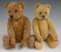Two Steiff or similar Teddy bears both with blonde mohair, shaved snout, straw filling, disc