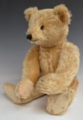 Steiff Teddy bear with blonde mohair, straw filling, disc joints, stitched features and button to