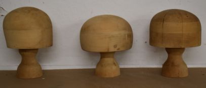 Three turned wood milliner's blocks / hat stands, D 21 x H25cm