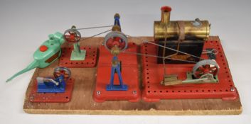 Mamod stationary live steam plant with engine, hammer, press, pulleys and oil can, mounted on wooden