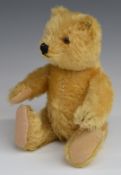 Steiff Teddy bear with blonde mohair, straw filling, disc joints, stitched features and button to