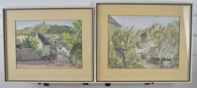 Pair of Doffla E Bennett watercolour townscapes of Dunster including the castle, both signed and