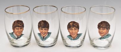 Set of four 1960s Beatles transfer decorated drinking glasses with gilt rims, produced by Joseph