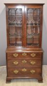 Georgian mahogany astragal glazed cabinet on chest, the top having shelves with various slots to