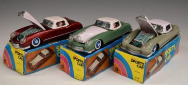 Three Lucky friction powered tinplate Sports Cars with opening car hood and front engine action, all
