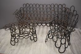 Garden furniture suite made from horseshoes comprising sofa, chair and table