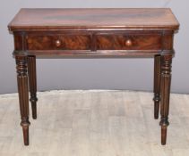 Mahogany side table with two drawers, raised on four reeded legs, W100 x D50 x H78cm