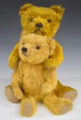 Two Merrythought or similar teddy bears both with golden mohair, straw or similar filling, disc