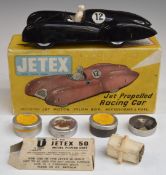 Jetex model Jet Propelled Racing Car with black body and racing number 12, in original box.