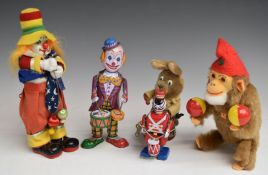 Five clockwork toys comprising two clowns, drumming Rabbit, Soldier and a Carl Monkey.