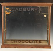 Cadbury's chocolate shop display advertising cabinet with name carved to base and on glass, also