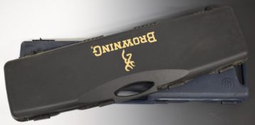 Two shotgun hard carry cases, one Beretta the other Browning.