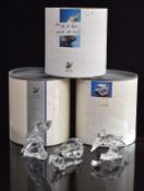 Four Swarovski Crystal glass animals and animal groups comprising two whales, two dolphins, seal and