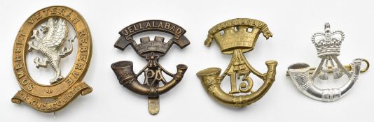 Four British Army metal badges comprising Somerset Veteran Regiment, The Rifles and two for the
