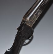 Essex Firearms Co .410 bore side by side shotgun with scenes of dogs engraved to the locks, engraved