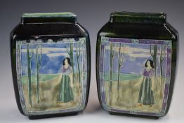 Pair of Royal Doulton faience vases with tube lined decoration of a lone figure and the same