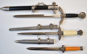 Three replica Nazi daggers, longest blade 29cm, all with sheaths. PLEASE NOTE ALL BLADED ITEMS ARE
