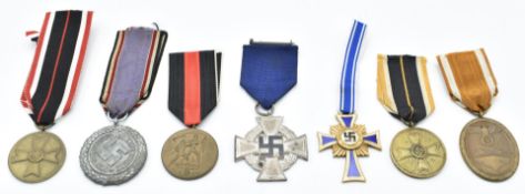 Seven German WW2 Nazi Third Reich medals including Mother's Cross, Atlantic Wall and Für