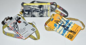 Three signed Formula 1 paddock passes on lanyards comprising Rubens Barrichello 2002 US Grand