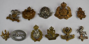 Eleven British Army metal Yeomanry badges including North of Ireland IY, Lanarkshire Yeomanry,