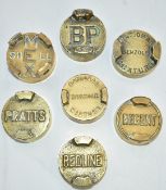 Seven vintage two gallon petrol can caps comprising Redline, Regent, Pratts, Shell Mex, BP and two