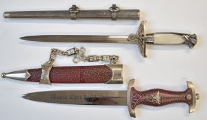 Two replica Nazi daggers, longest blade 25cm, both with sheaths. PLEASE NOTE ALL BLADED ITEMS ARE