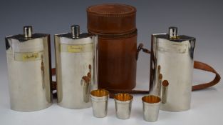 Circular leather spirit flask container with three sectional spirit flasks and four tot cups, height