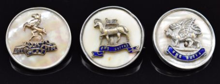 Three mother of pearl and enamel sweetheart brooches for the Buffs, Royal West Kent Regiment and the