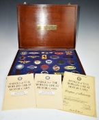 Cased set of twenty five silver and gold plated and enamel Badges of The World's Greatest Motor