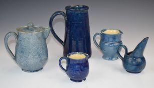 Farnham Art Pottery four jugs and a large tankard, the covered jug with Harris backstamp, tallest