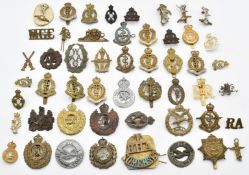 Approximately fifty British Army badges including Royal Army Medical Corps, Royal Engineers,