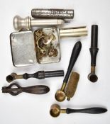 A collection of gun and shooting tools and accessories including powder measures, cartridge de-