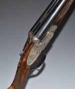 Sabel Regal 12 bore side by side ejector shotgun with floral and scrolling engraving to the hand-