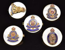 Five mother of pearl, metal and enamel sweetheart brooches comprising three for the Royal Ordnance