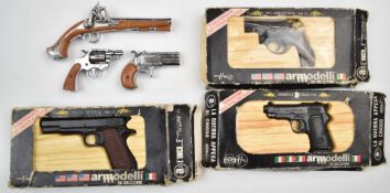 Six replica and cap firing guns including three Uniwerk Armodelli in original boxes.