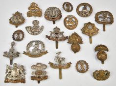 Twenty British Army Infantry badges including Norfolk Regiment, Northumberland Fusiliers, East