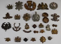 Eleven Scottish Regiment metal badges including Cameronians, King's Own Scottish Border Regiment,