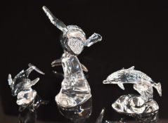 Three Swarovski Crystal clear and coloured glass animals comprising two whales and a dolphin,