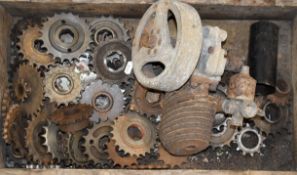 Box of British motorcycle sprockets and a small two stoke engine etc
