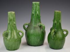 Farnham Art Pottery garniture of vases with loop handles and drip decoration, tallest 25cm