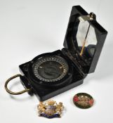 WW2 marching compass Mk1 by TG Co Ltd, with serial number B75492 and broad arrow mark together