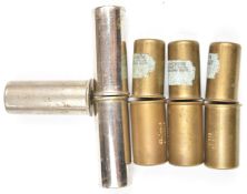 Nine collectable shotgun snap caps including William Evans, Harrison & Hussy, Holland & Holland,