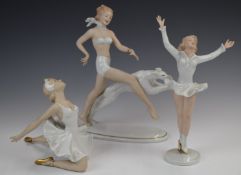 Three Wallendorf figures comprising skater, ballerina and bather with dog, tallest 27cm