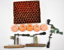 A collection of shotgun cartridge re-loading tools and accessories including 12 bore rollover