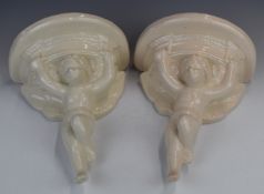 Pair of figural cherub pottery wall brackets with impressed marks verso 'FV B/Stone, Poole,