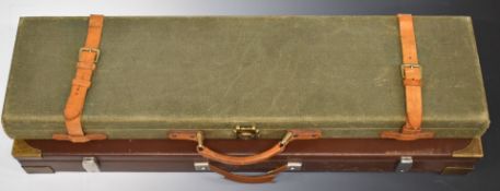 Two shotgun carry cases, one Gunmark with leather straps (80.5 x 21 x 7.5cm) the other faux